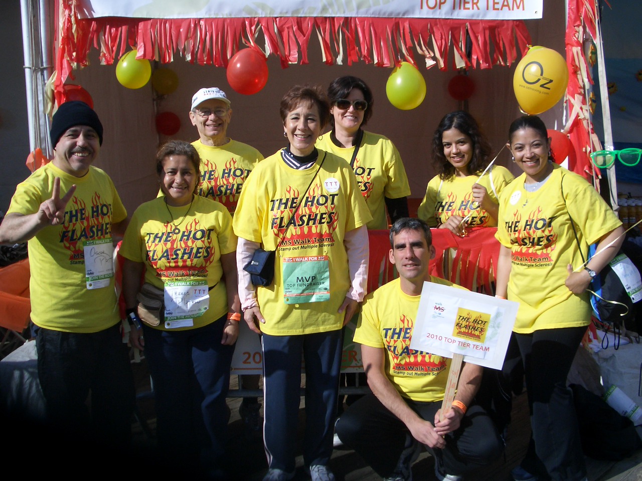 Picture of the Hot Flashes team at South Street Seaport in 2010, by the tent